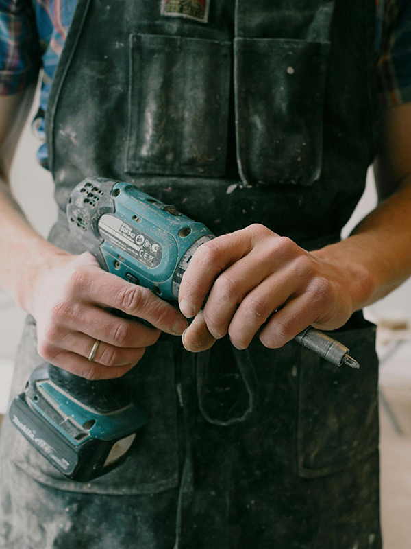 DFW Handyman Holding A Tool